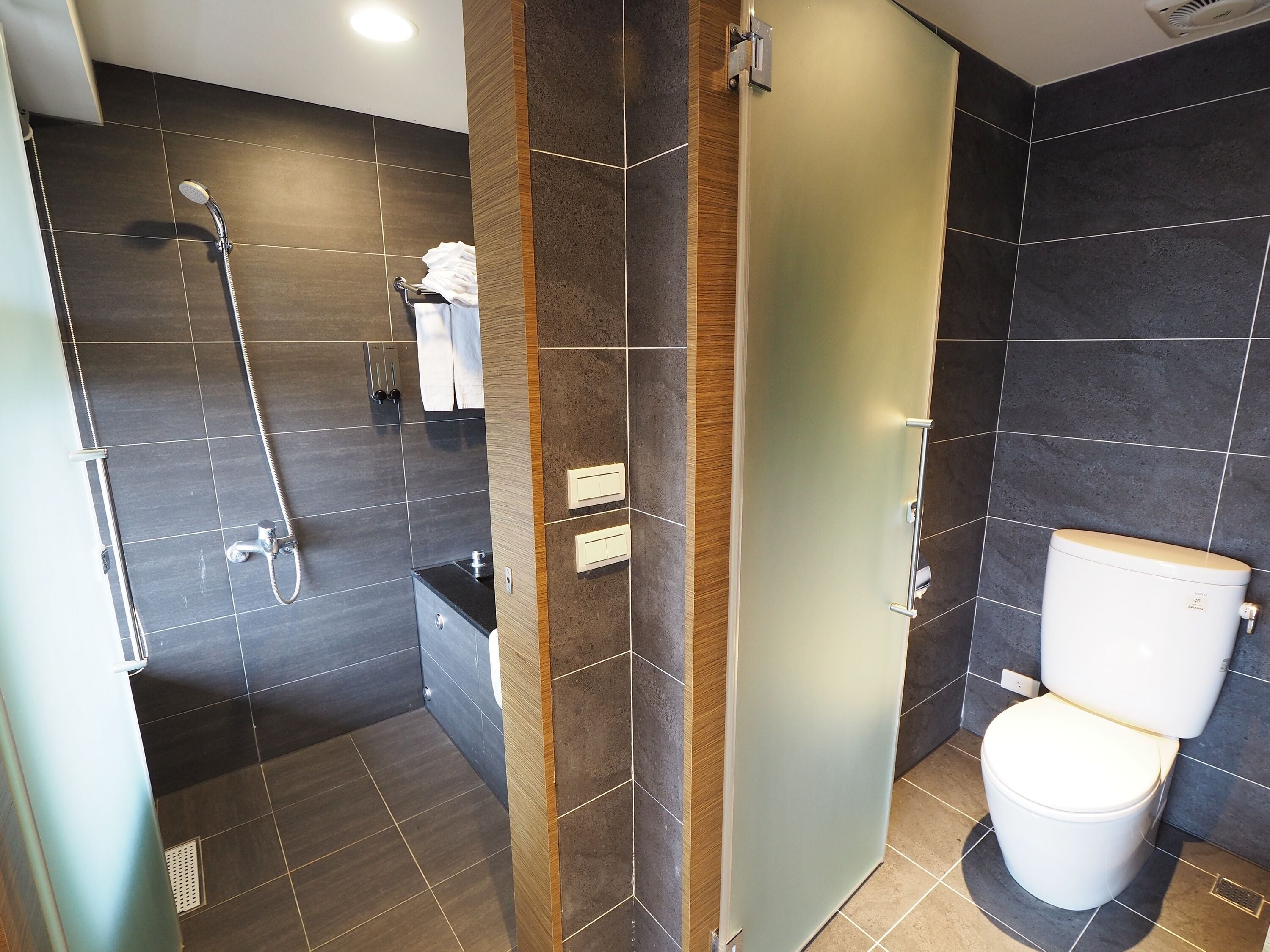 deluxe quadruple room | bathroom | separate bathtub and shower, spring water bathtub, rainfall showerhead