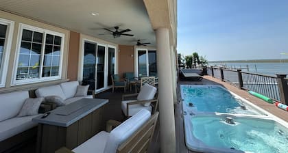 On Water.Boat/Jet Skis/golf cart . Pool/Hot tub/IceSpa, huge decks, game rooms.