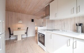 Fridge, stovetop, dishwasher, coffee/tea maker