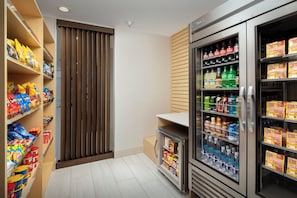 A snack and beverage vending area with various snacks and drinks. - Holiday Inn Express & Suites Kingsland I-95-Naval Base Area by IHG (Kingsland)