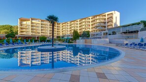 Indoor pool, seasonal outdoor pool, pool umbrellas, pool loungers