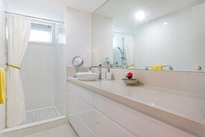 Shower, hair dryer, towels, shampoo