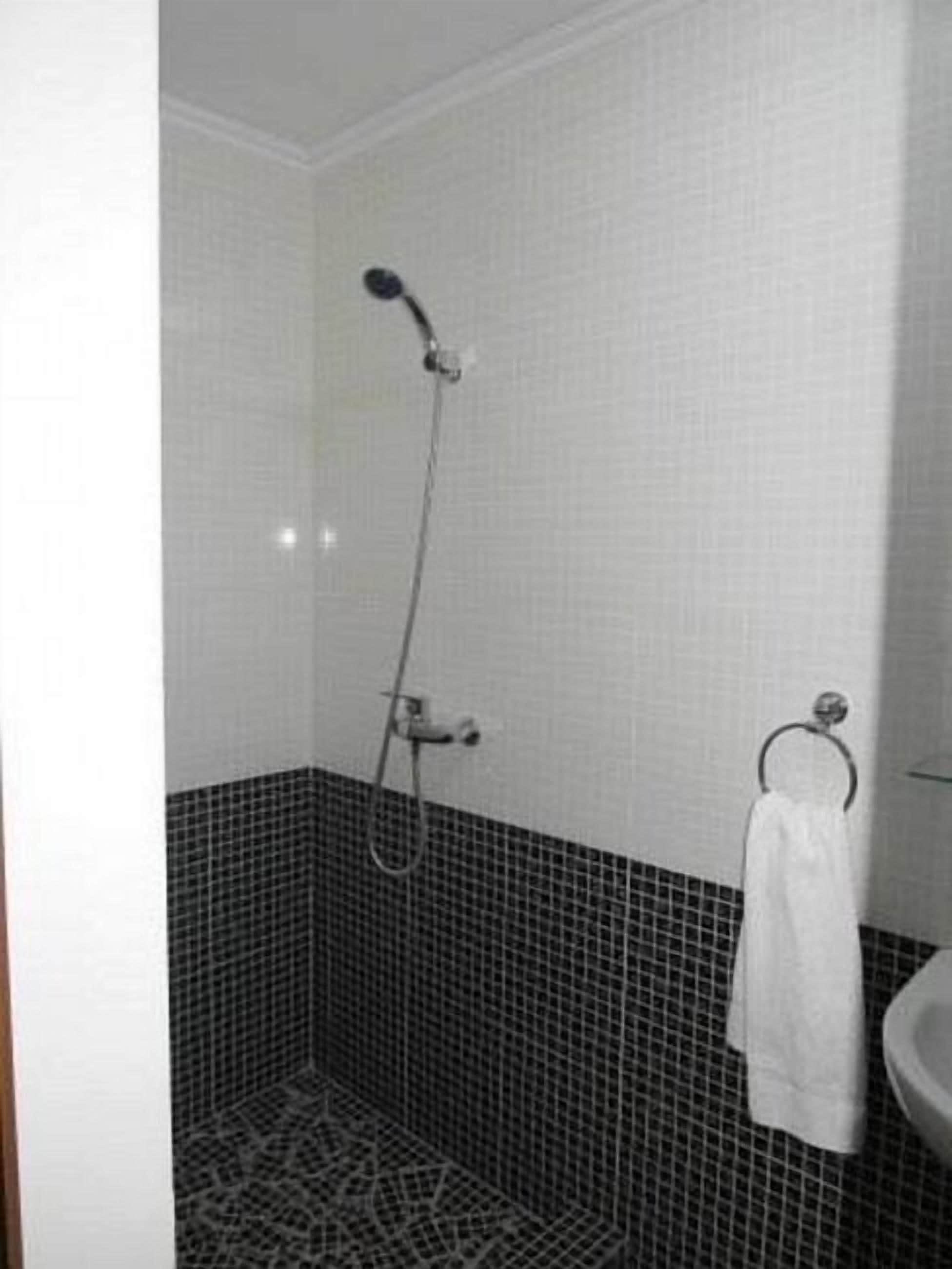 junior suite | bathroom | shower, free toiletries, hair dryer, slippers