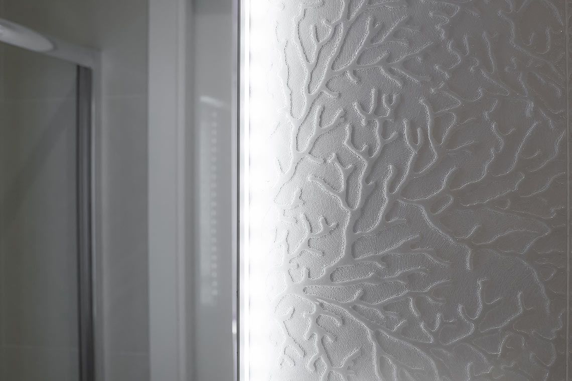A textured wall with a leaf-like pattern.