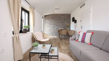 Superior Suite | Living area | Flat-screen TV