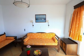 Suite, 1 Bedroom, Sea View | Living area | Plasma TV
