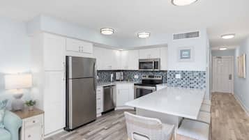 Fridge, microwave, coffee/tea maker, cookware/dishes/utensils