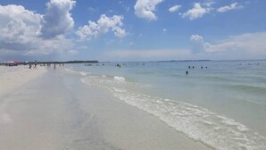 A beach with clear skies and calm waters. - Bayside Villa 4208 | Stunning Harbourview Residence| Walk to the Beach (Captiva)