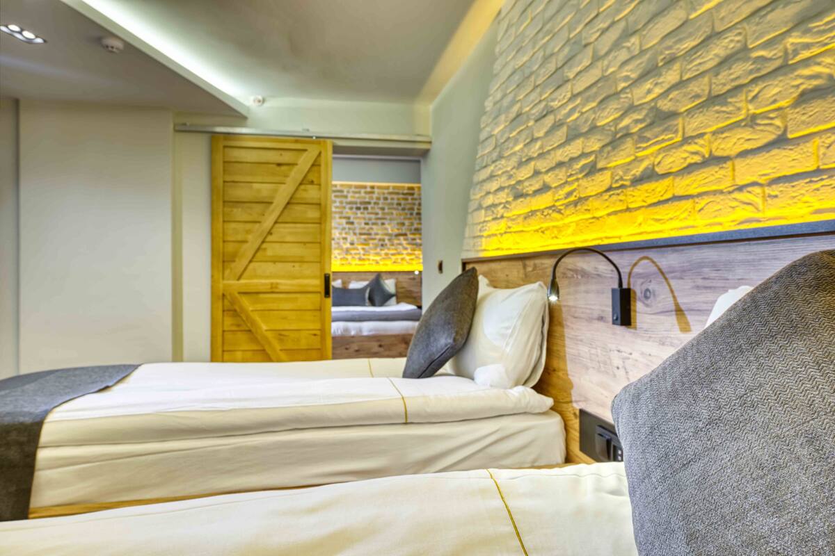 Family Suite | Minibar, in-room safe, desk, laptop workspace
