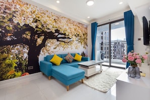 Comfort Apartment | Living area | 49-inch flat-screen TV with cable channels, TV, pay movies