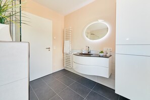 Shower, hair dryer, towels, toilet paper