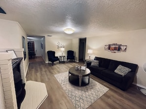 New flooring in this cozy living room. Enjoy cool nights with the fireplace!