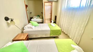 Standard Triple Room | Individually decorated, individually furnished, laptop workspace