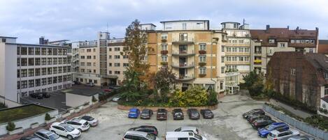 A multi-story parking garage with cars parked in rows.