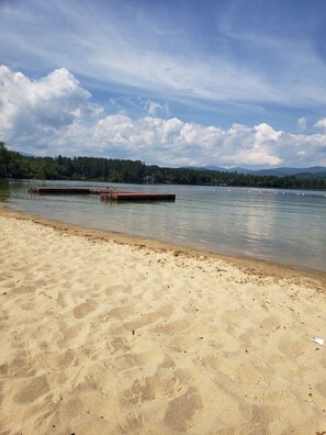 Enjoy serene lakeside views and activities from the wooden dock.