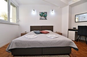 Apartment, 2 Bedrooms, Balcony | In-room safe, desk, soundproofing, iron/ironing board