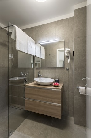 Apartment, Pool Access | Bathroom | Shower, hair dryer, towels, soap