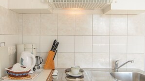 Private kitchen | Fridge, stovetop, electric kettle, cookware/dishes/utensils - Holiday Apartments Ciovo (Okrug)