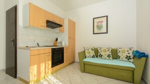 Private kitchen | Fridge, stovetop, electric kettle, cookware/dishes/utensils - Holiday Apartments Ciovo (Okrug)