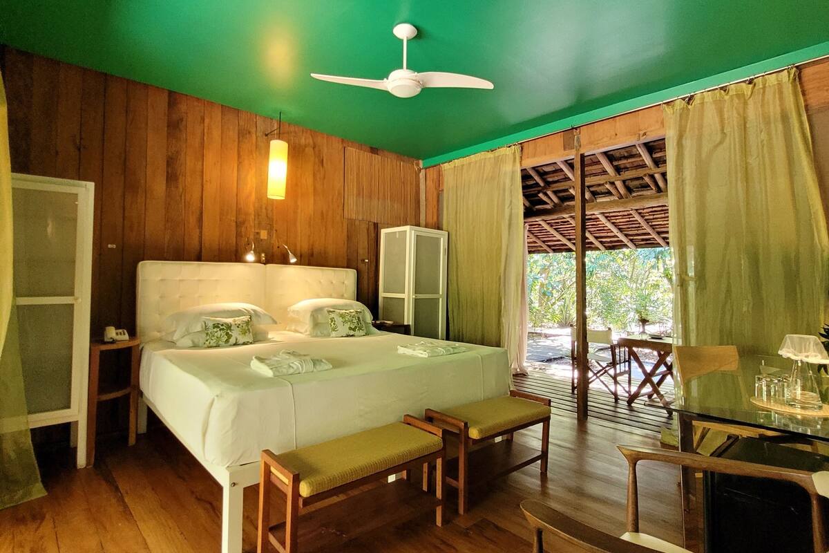 A room with a bed, a desk, and a chair.