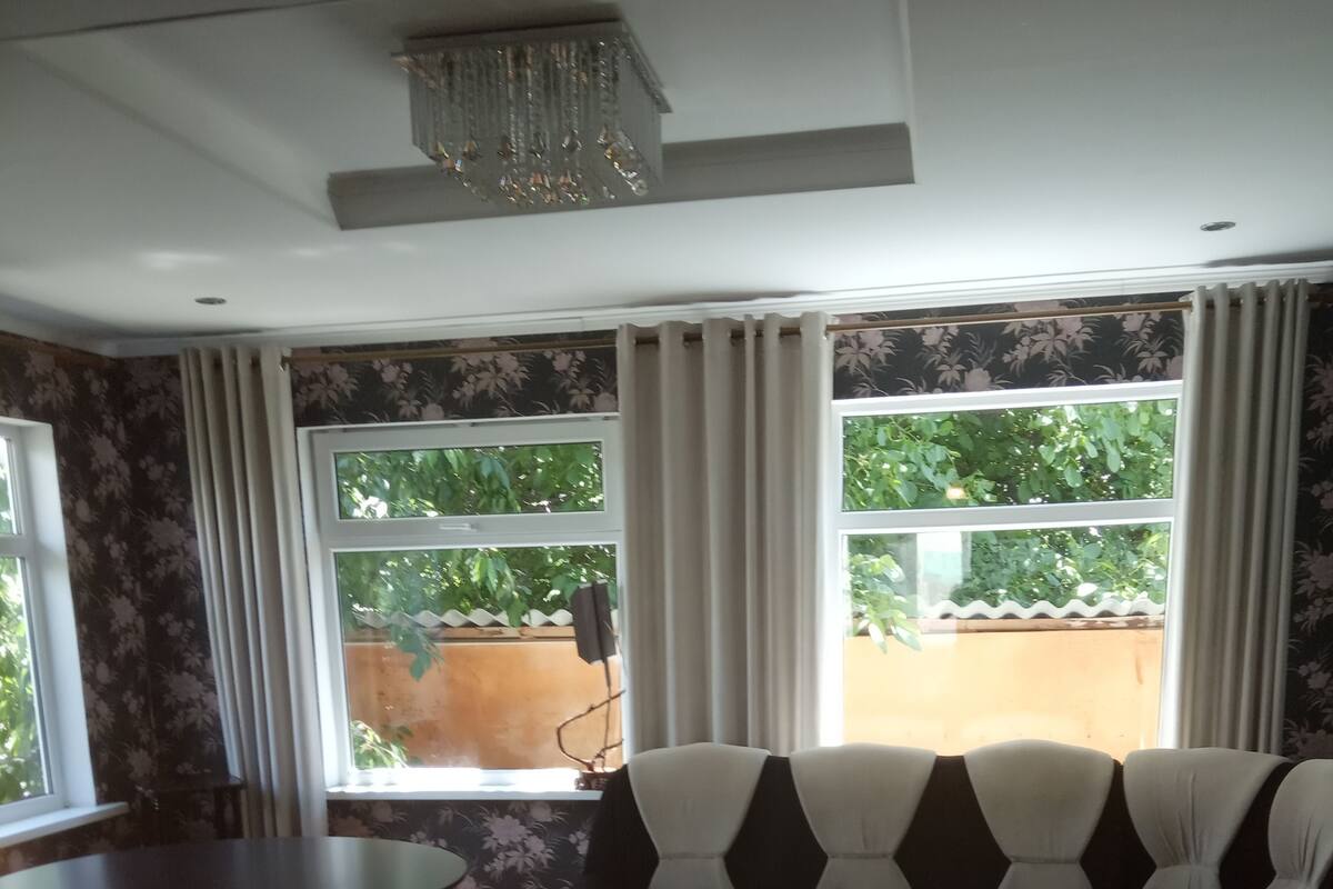 Family Apartment, Garden View | Blackout curtains, iron/ironing board (on request), rollaway beds