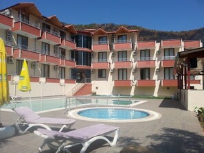 Seasonal outdoor pool, pool umbrellas, sun loungers