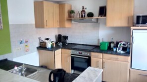 Apartment, 2 Bedrooms (90 m2) | Private kitchen | Fridge, microwave, stovetop, coffee/tea maker