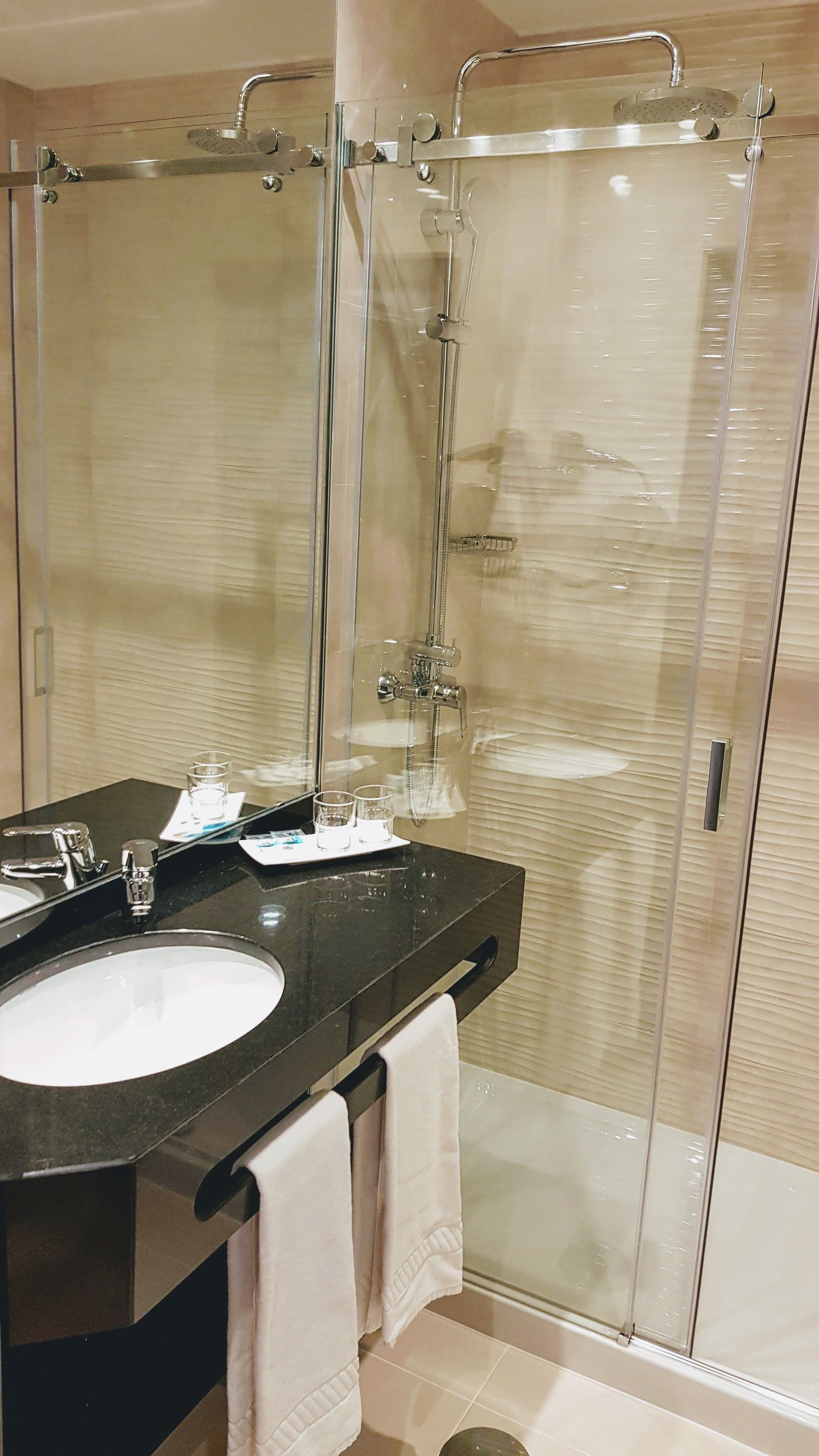 shower, rainfall showerhead, hair dryer, towels