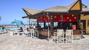 A beachside bar with outdoor seating and a pool. - First Floor Private Paradise Ocean Front Studio SPRING SALE! POOL OPEN!! (Daytona Beach)