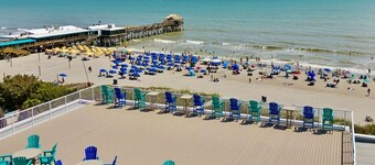 Sunny Shores Retreat: Pool, Balcony & Steps to the Ocean!