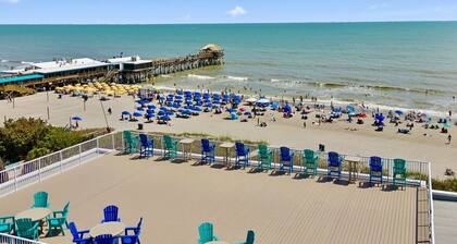 Sunny Shores Retreat: Pool, Balcony & Steps to the Ocean!