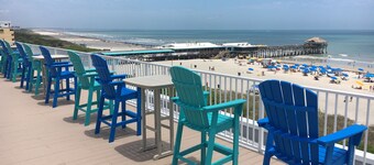 Sunny Shores Retreat: Pool, Balcony & Steps to the Ocean!