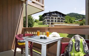 Enjoy the view from your balcony with a map, sunglasses, and a convenient place to store your belongings.