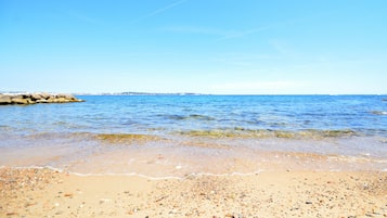 On the beach, sun-loungers