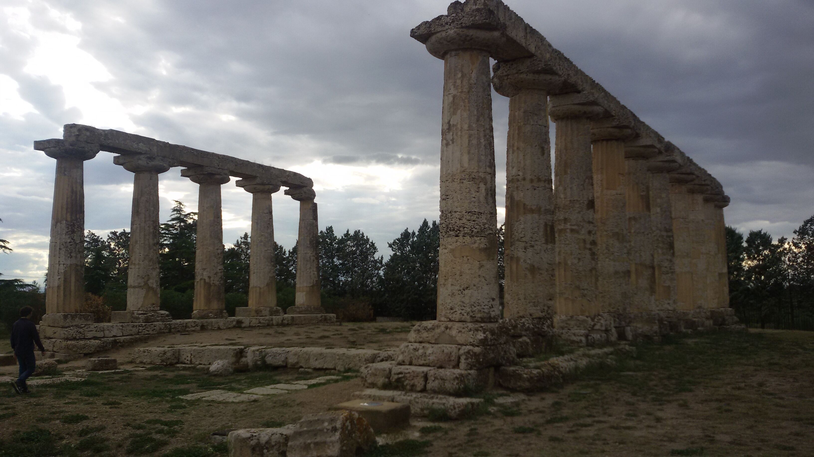 Ancient ruins with columns and stone structures.