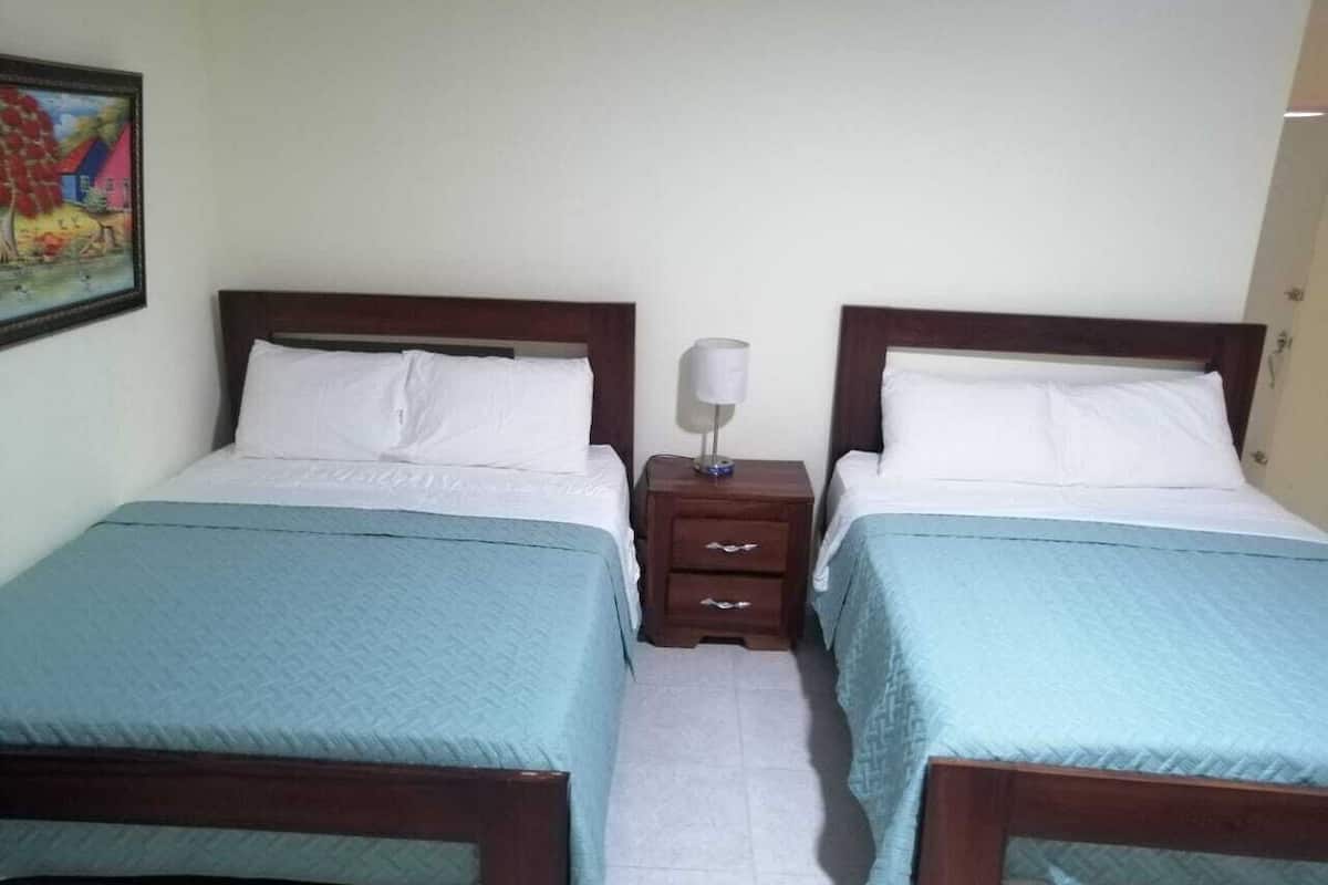 Pillowtop beds, laptop workspace, blackout drapes, iron/ironing board