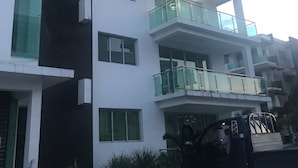 A multi-story building with balconies and large windows. - IV Verdana Rental (Puñal)