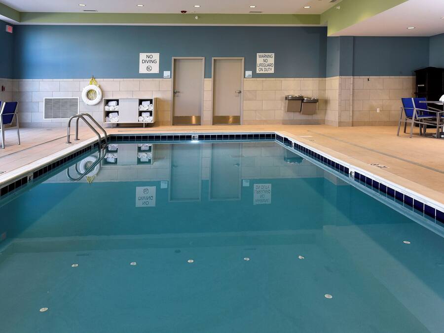 Indoor pool, open 8:00 AM to 10:00 PM, pool loungers