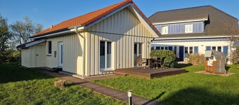 Close to the beach holiday home in a quiet field location with a spacious wooden terrace