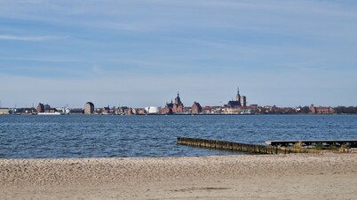 Close to the beach holiday home in a quiet field location with a spacious wooden terrace