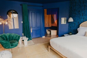 Deluxe Room | Premium bedding, minibar, in-room safe, individually decorated