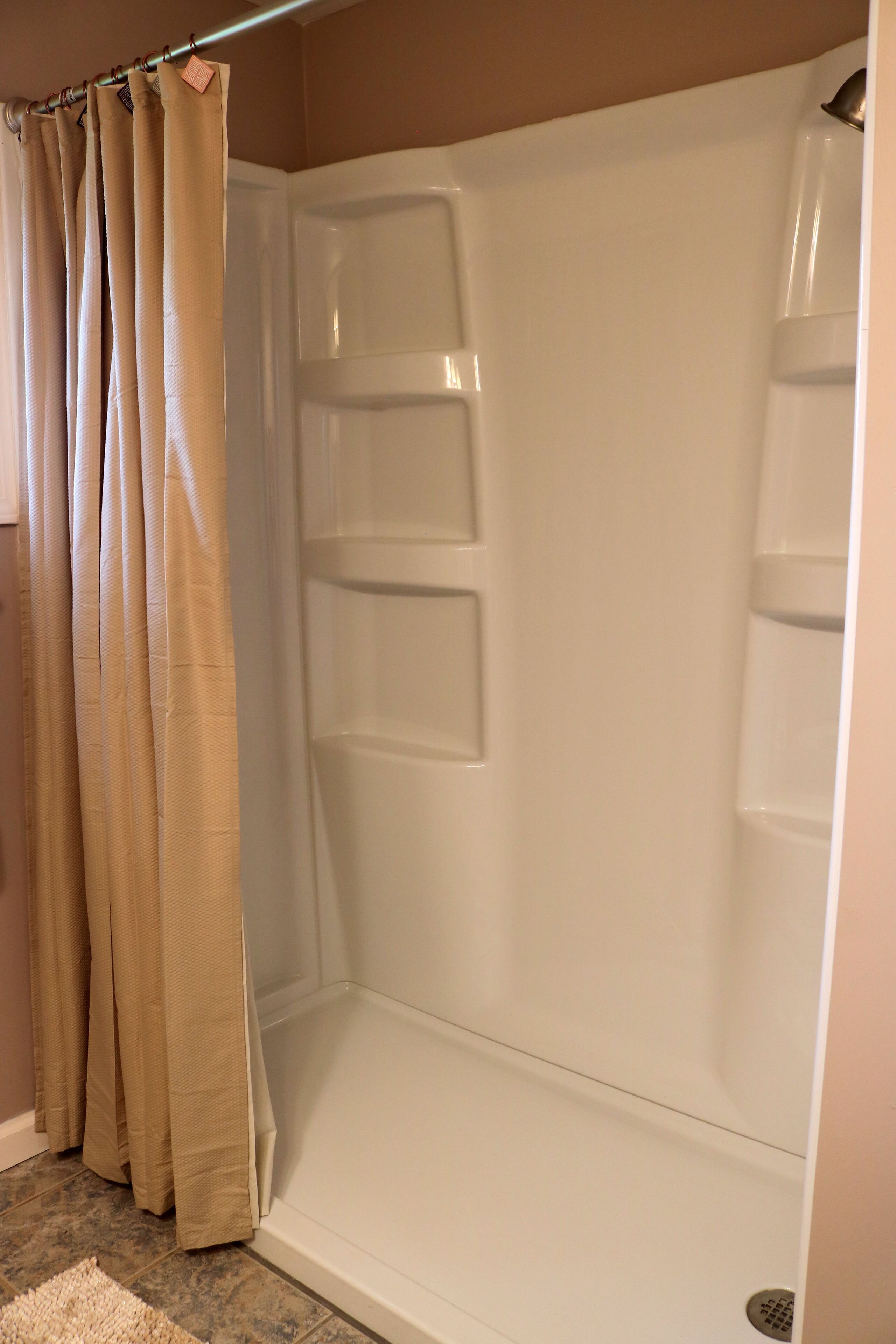 Shower, hair dryer, towels, toilet paper
