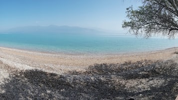 On the beach, sun-loungers