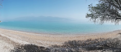 On the beach, sun-loungers