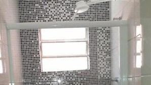 A bathroom with a shower, toilet, and sink. - Hotel Aruba (Curitiba)