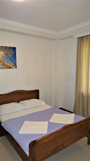 Quarto família, 2 quartos, sacada | Wi-Fi de cortesia, roupa de cama