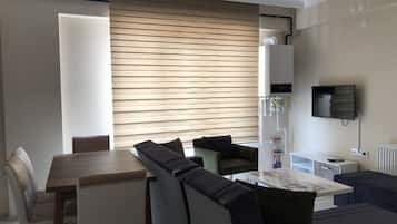 Apartment, 1 Bedroom | Living area | 82-inch LED TV with satellite channels, TV