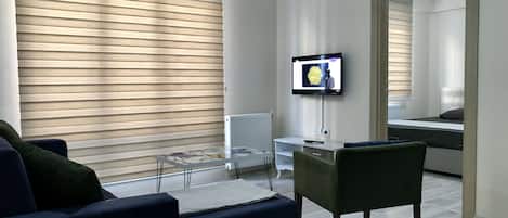 Apartment, 1 Bedroom | Living area | 82-inch LED TV with satellite channels, TV