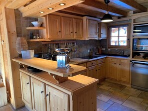 Enjoy cooking in this kitchen with oven and refrigerator.