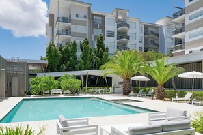 Outdoor pool, pool umbrellas, sun loungers